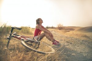 woman bicycle sunshine